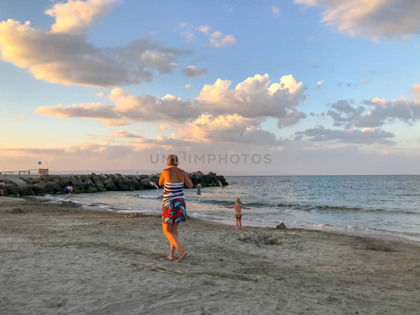 Pomorie, Bulgaria - July 08, 2019: People Relaxing On The Beach.