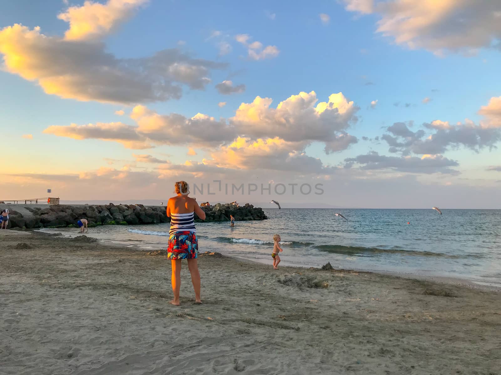 Pomorie, Bulgaria - July 08, 2019: People Relaxing On The Beach. by nenovbrothers