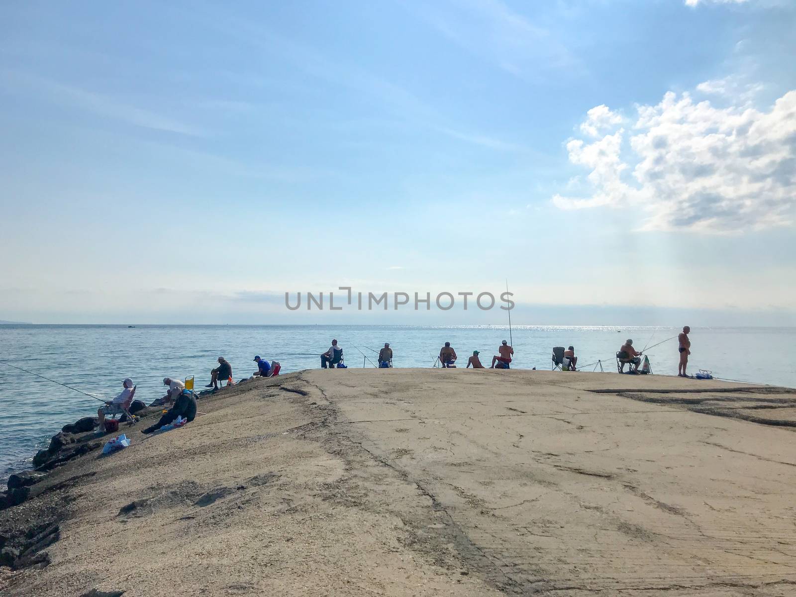 Pomorie, Bulgaria - July 16, 2019: Fishermen Hunt Fresh Fish Behind The Coasts Of The Sea Town.
 by nenovbrothers