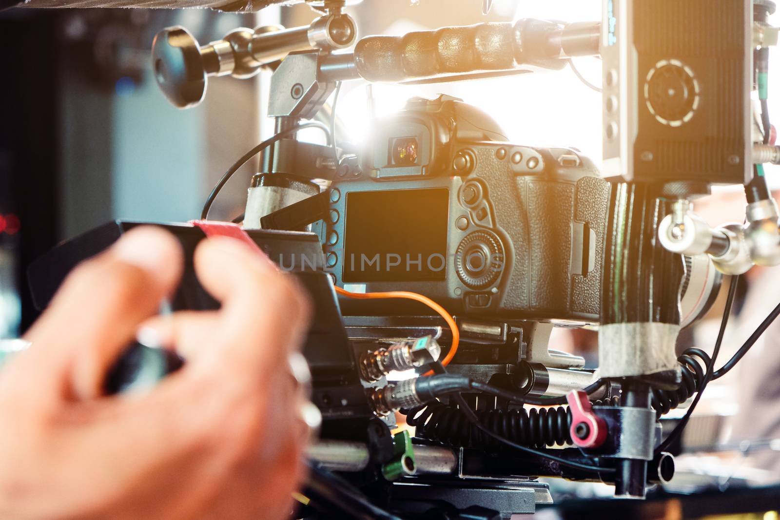 Behind the scene. cameraman shooting film scene with camera