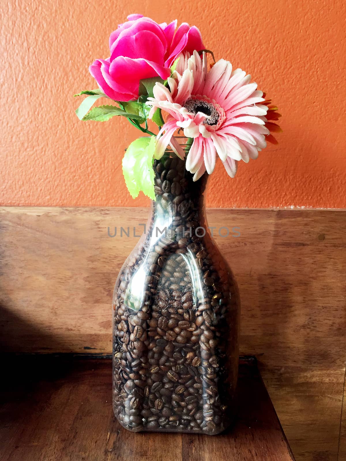 flower vase filled with coffee beans.