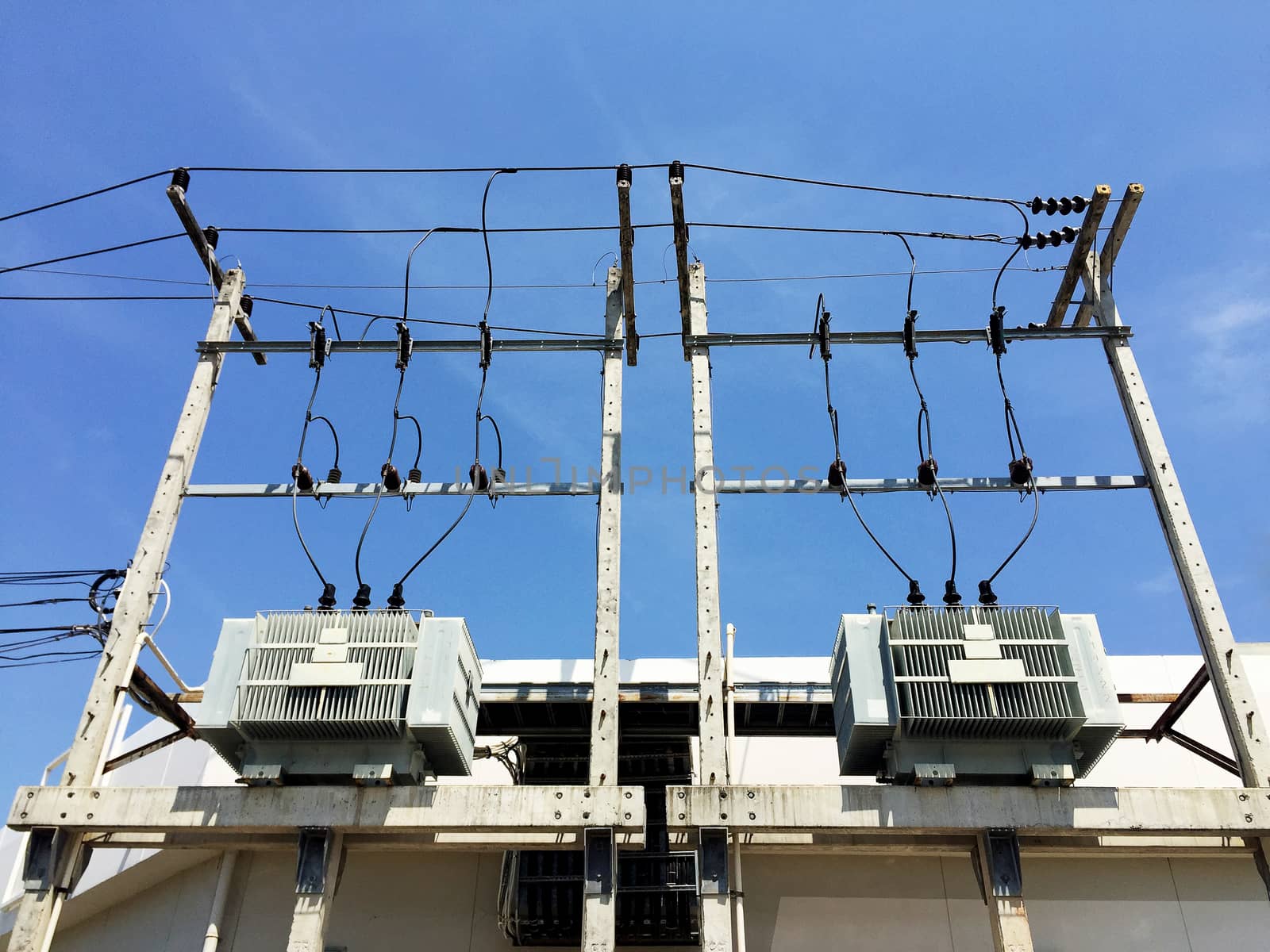 Electricity post and a blue sky background. electrical transformer