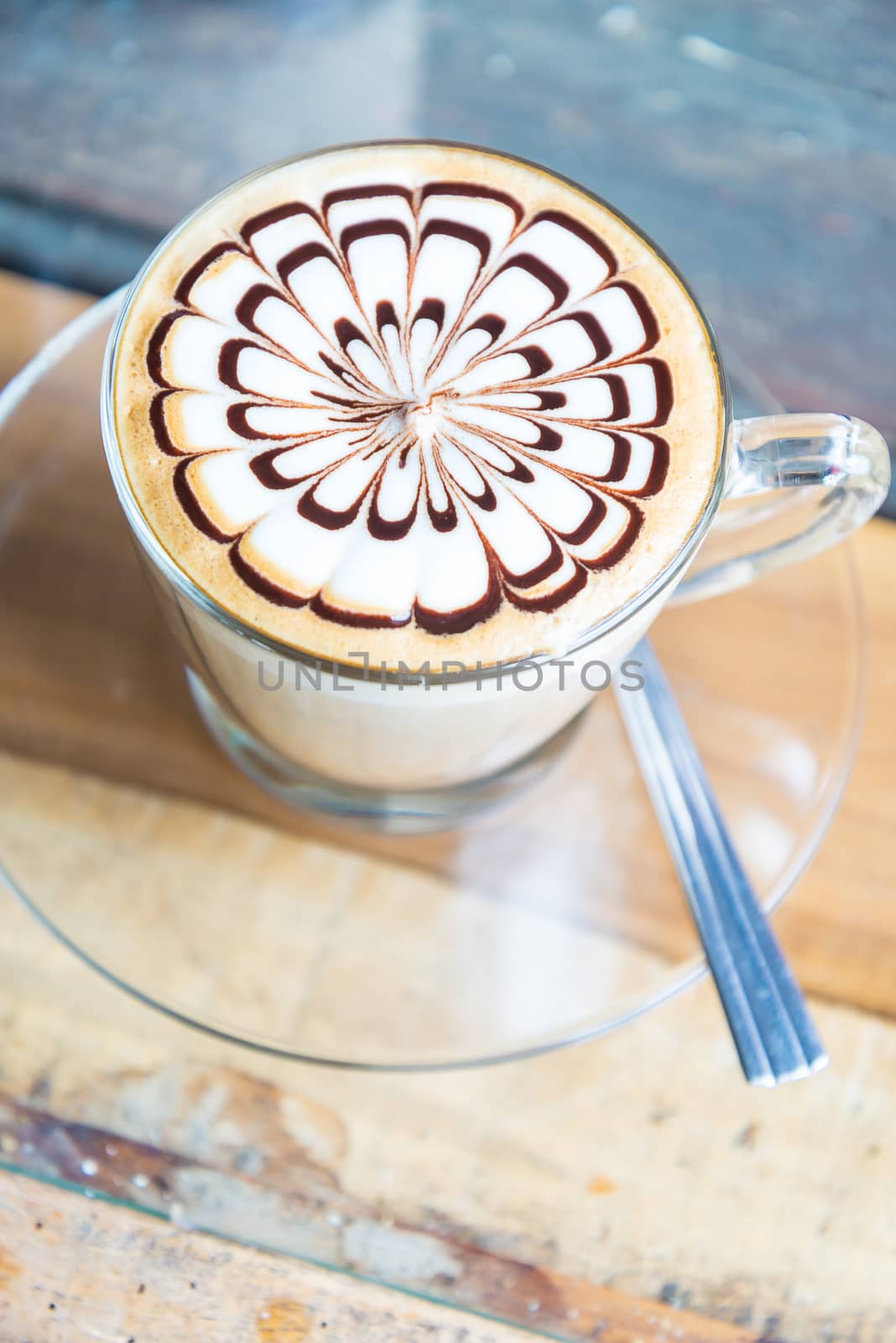 Hot coffee in white cup on the  table.