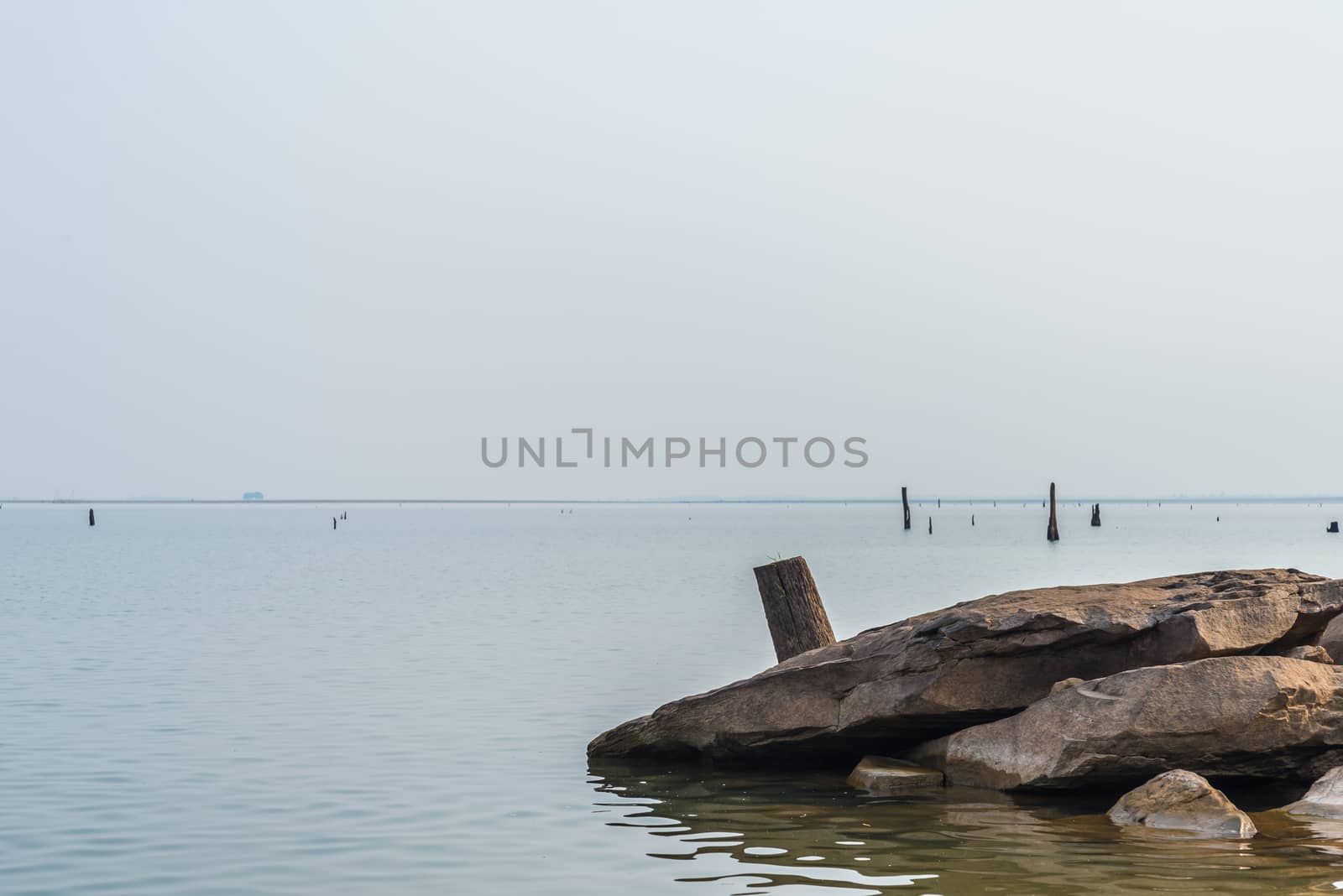 Rocks and stumps on the banks of the reservoir.