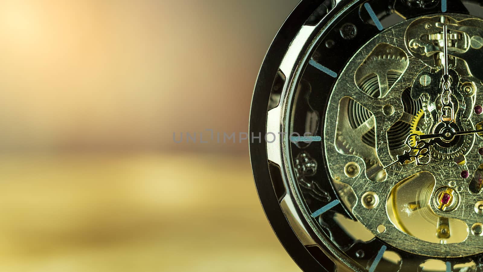 Closeup pocket watch on table and sunlight. At 8 am. o'clock in the morning. Concept of starting work today.