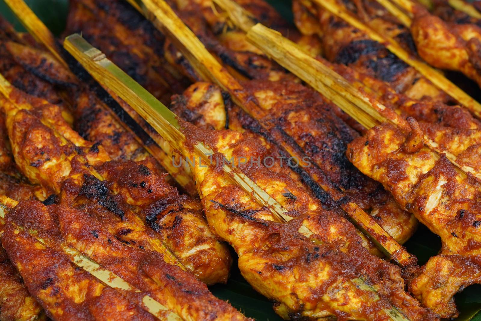 Malaysian traditional dishes, popular grilled spiced chicken Ayam Percik selling in Bazaar during the holy month of Ramadan.