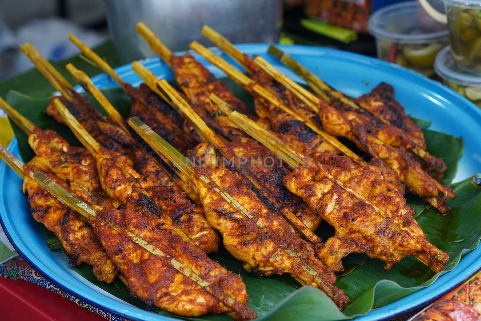 Malaysian traditional dishes, popular grilled spiced chicken Ayam Percik selling in Bazaar during the holy month of Ramadan.