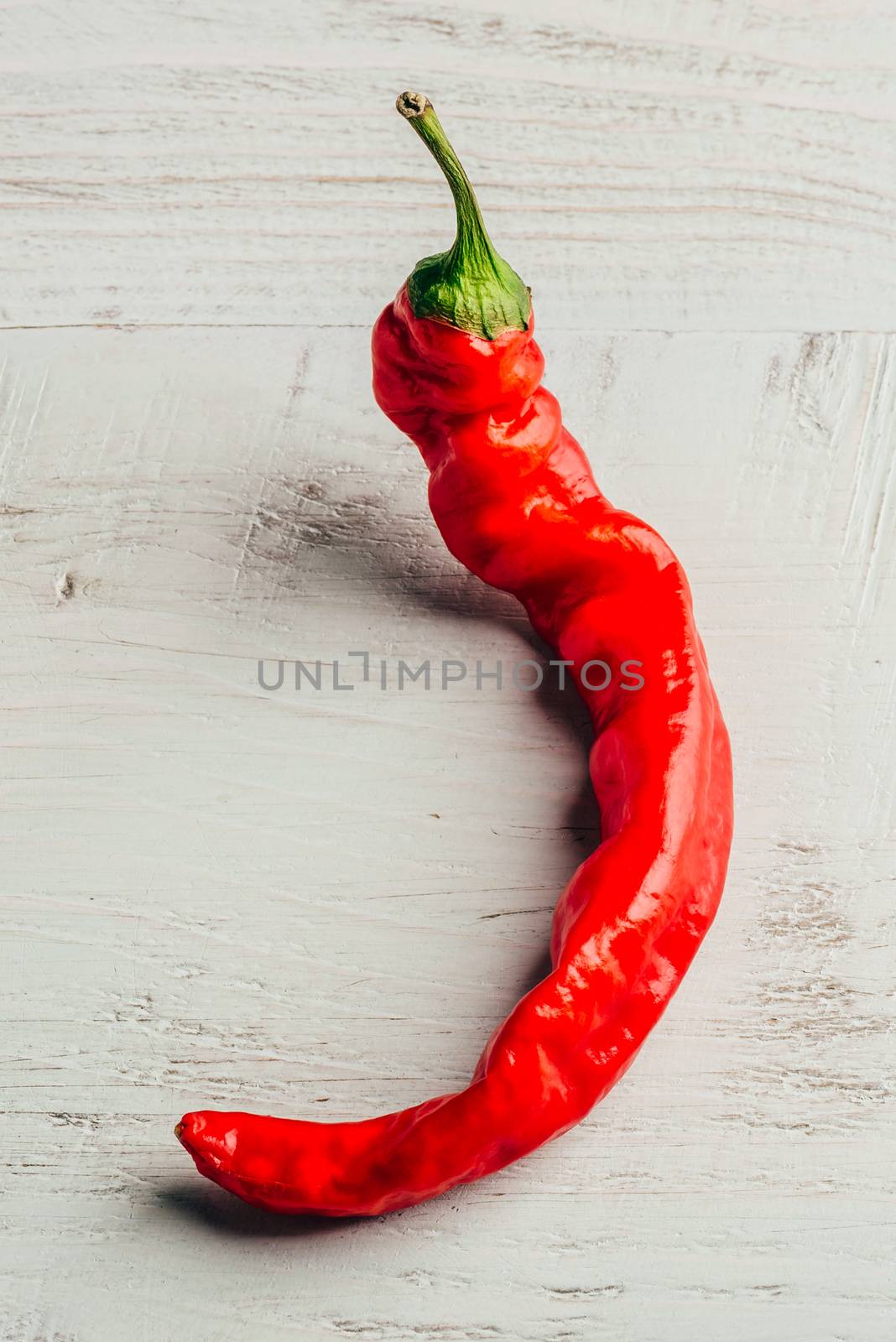 Chili pepper on wooden background. by Seva_blsv