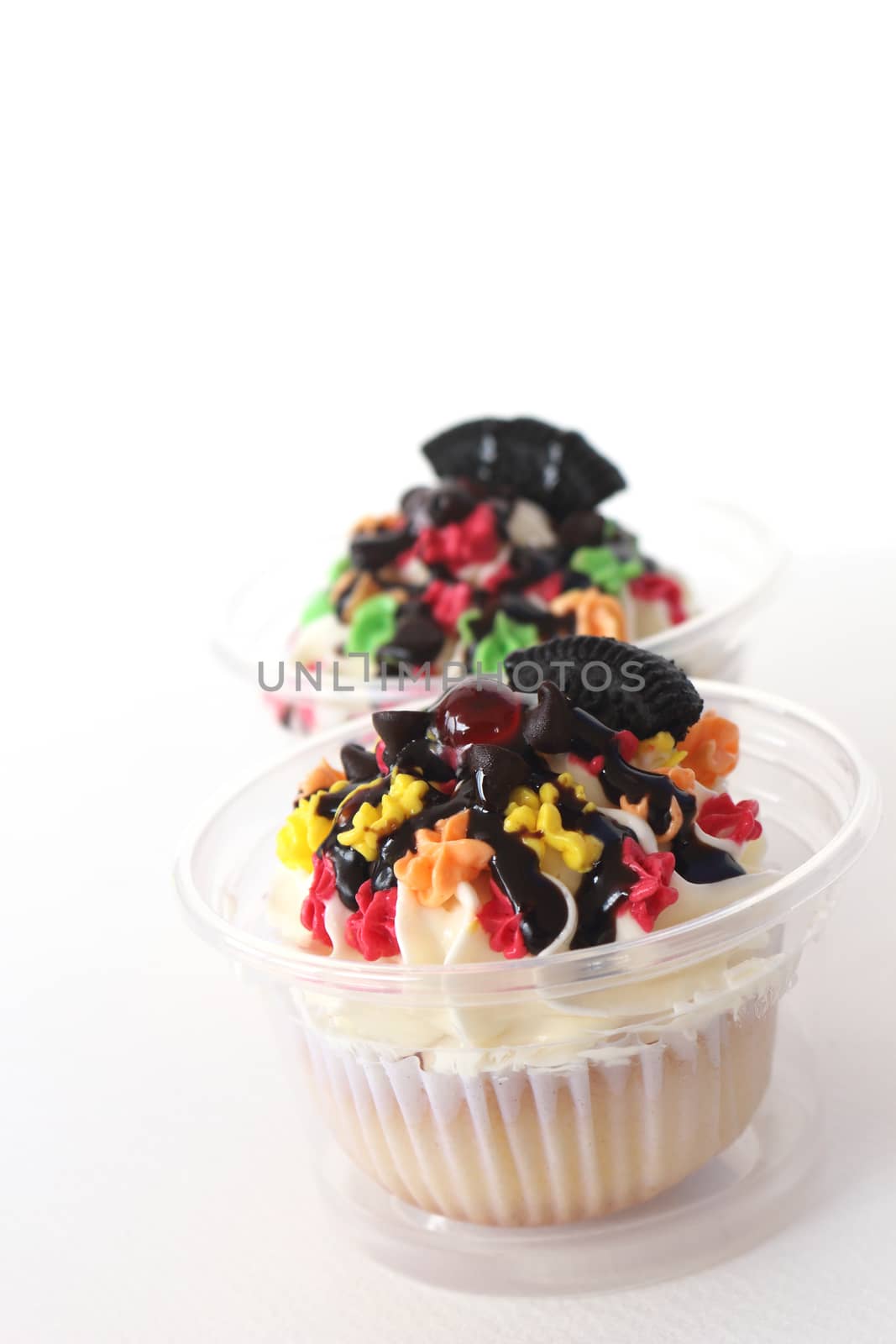 two fancy cupcake on white background