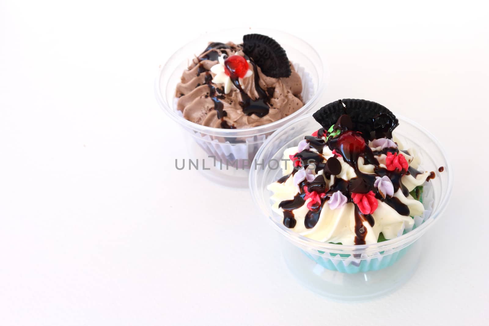 two fancy cupcake on white background
