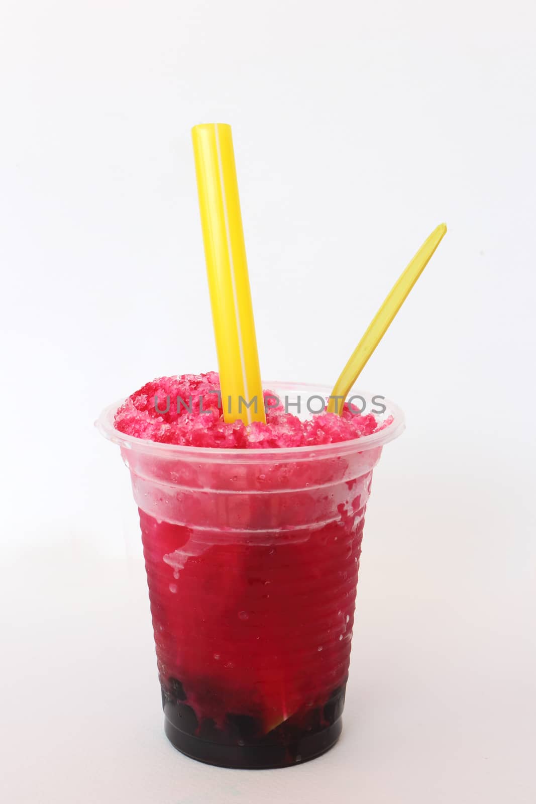 Glass of red shave ice on white background