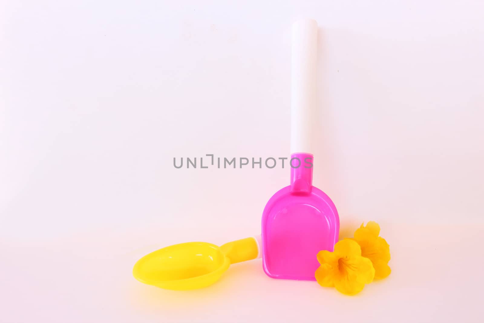 Two plastic kitchen toy on white background.