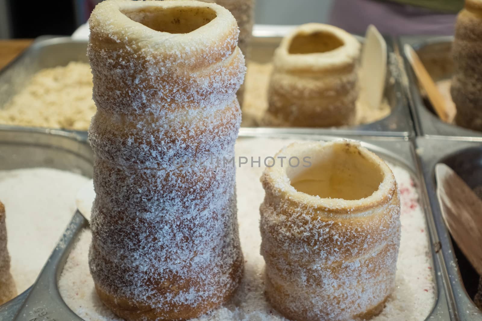 Hungarian and Czech Twist Roll. Hungarian "Kurtoskalacs ", Czech "Kurtos" prepared on the grill, at a traditional street food market.