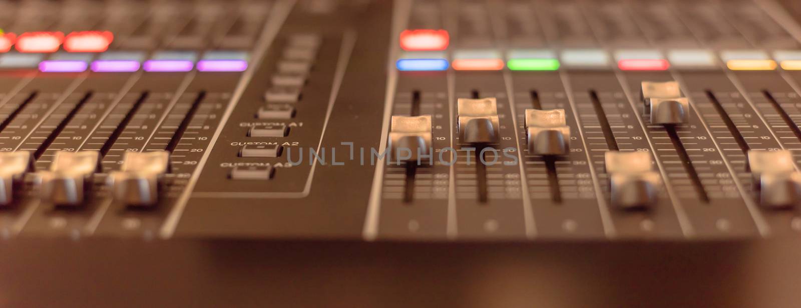 Panoramic view colorful sound mixer control DJ turntable close-up by trongnguyen