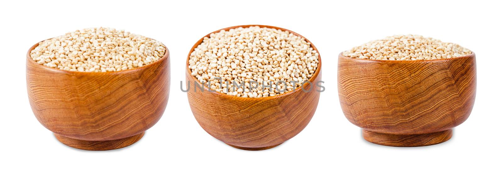 Raw quinoa seeds in wooden bowl. by Gamjai