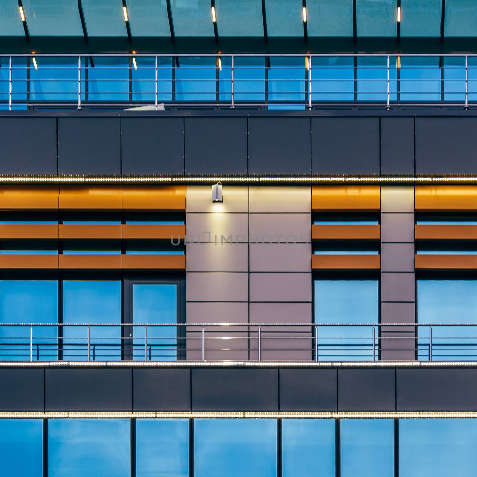 Modern high-rise building with a glass facade. by Seva_blsv