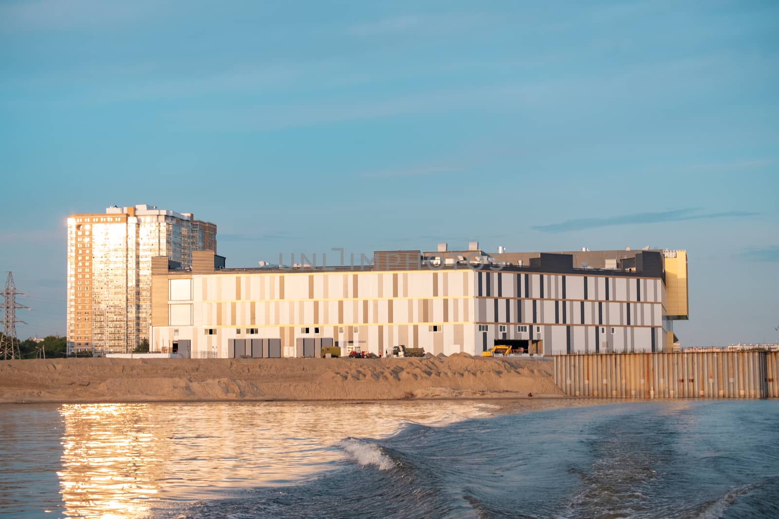 View of the city of Khabarovsk from the Amur river. Urban landscape in the evening at sunset