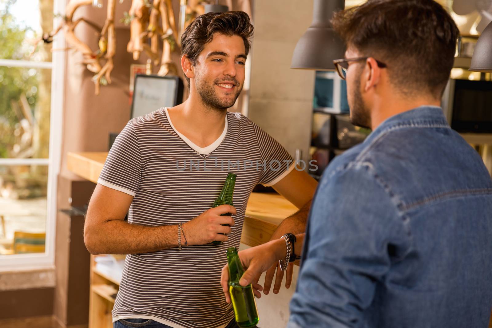 Two friends having a drink at the pub 