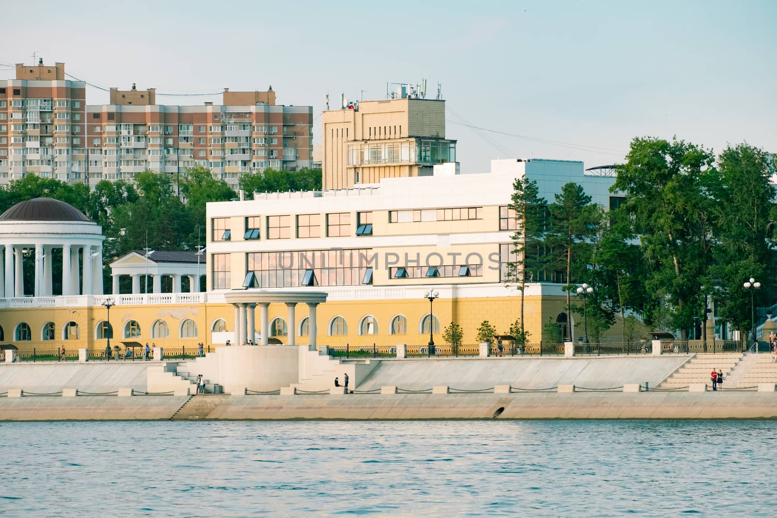 View of the city of Khabarovsk from the Amur river. Urban landscape in the evening at sunset