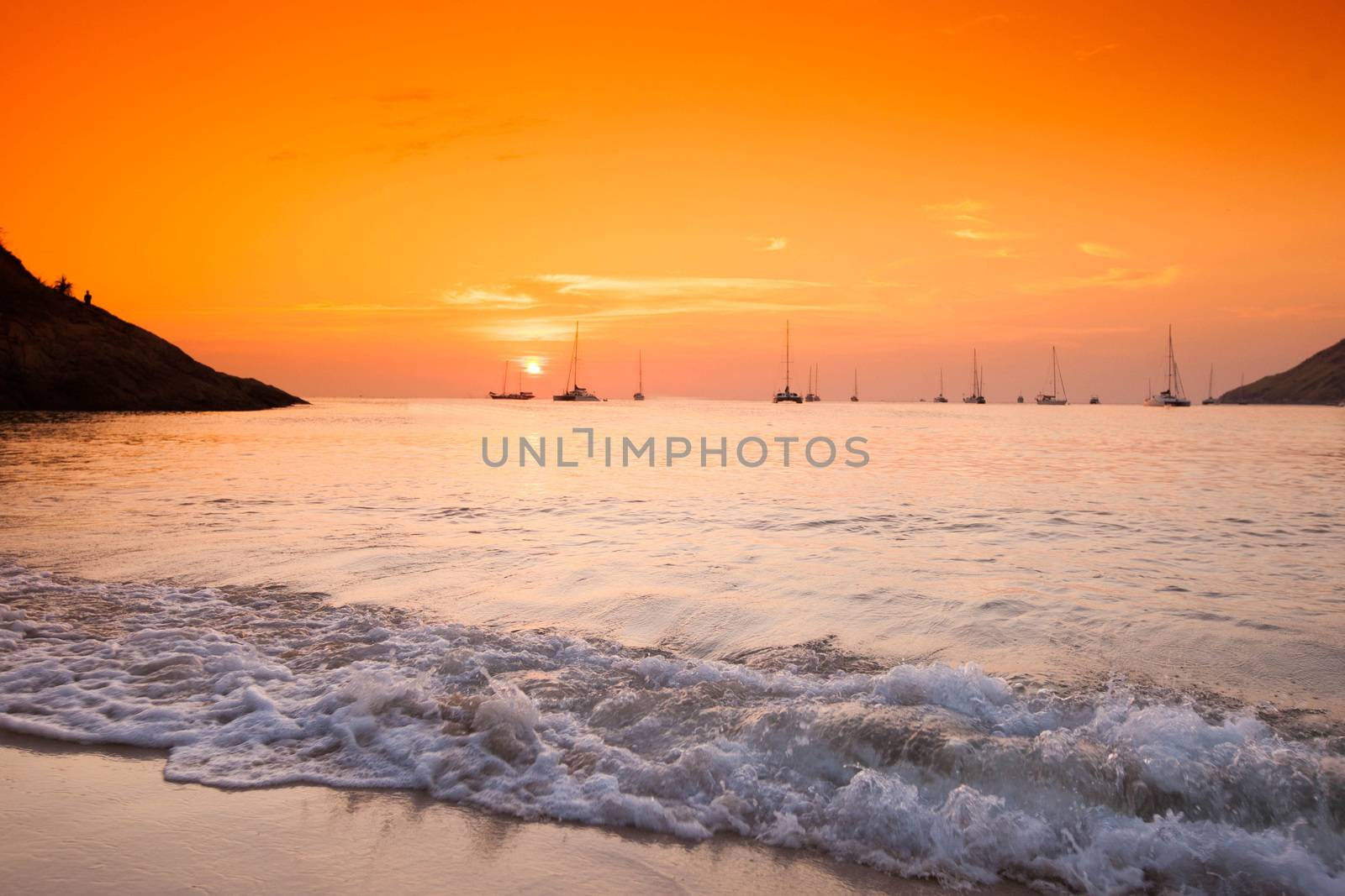 Beautiful sunset with orange sky over blue sea