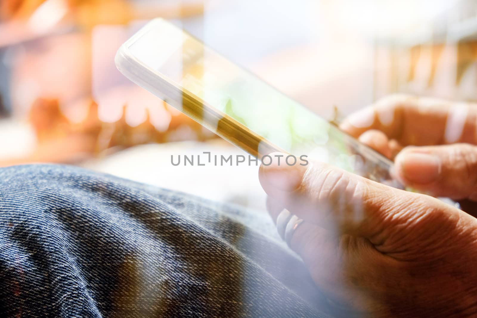 Hands with mobile, double exposure