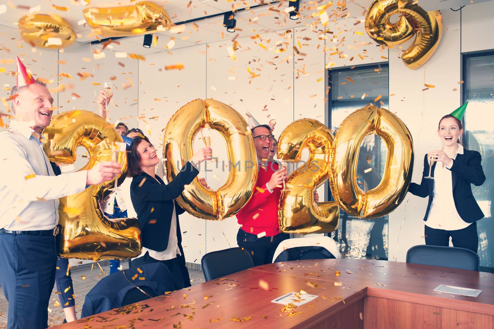 Business people celebrating 2020 New Year at office party