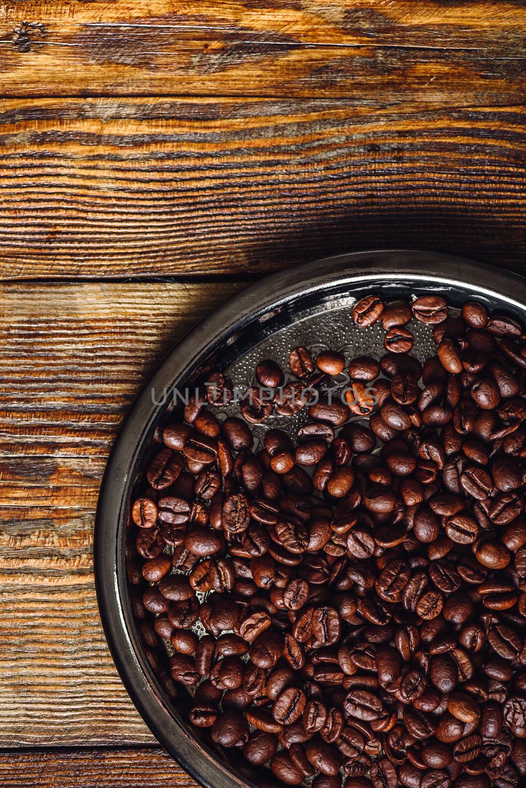 Coffee Beans on Metal Plate. Vertical Orientation and Copy Space.