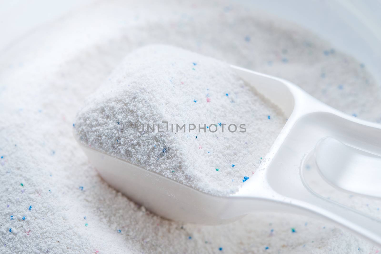 washing powder with measuring cup on a washing powder box