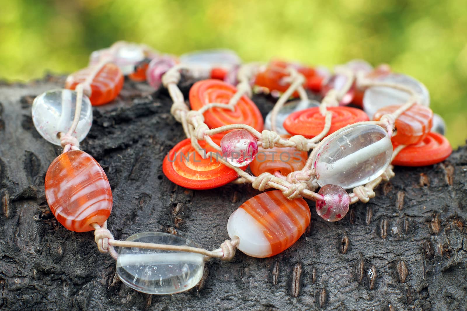 Wooden glass beads hand made eco style on the wooden background