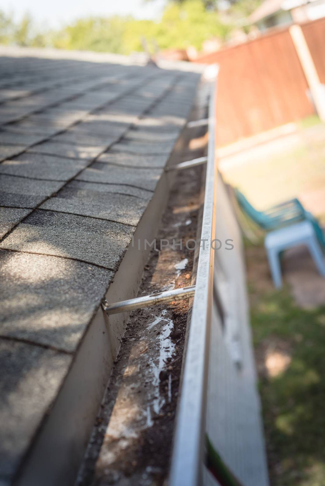 Top view clear gutter after cleaning from leaves and dirt by trongnguyen