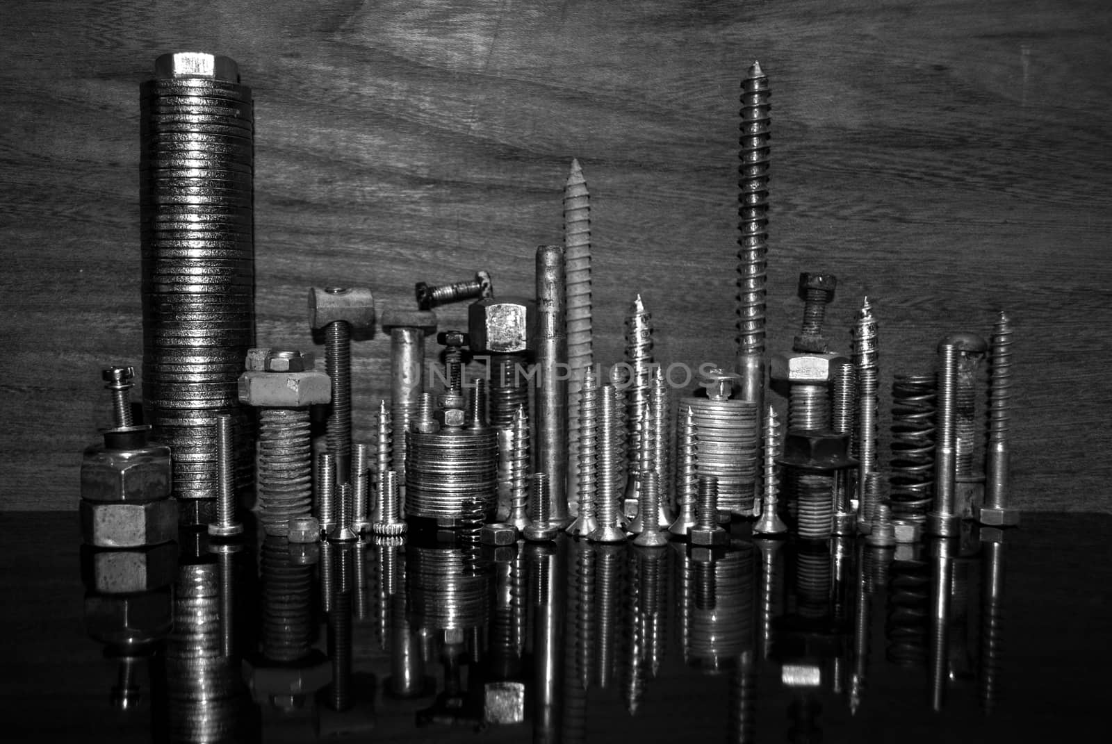 Screws and nuts forming a cityscape