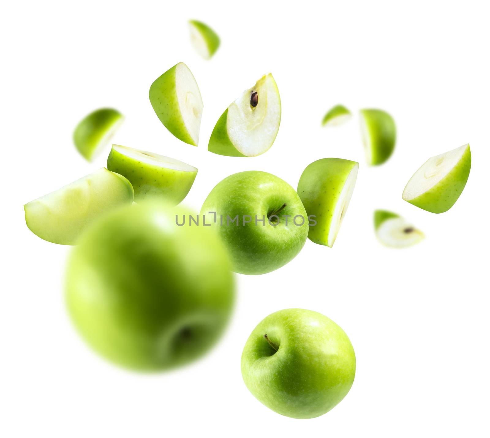 A group of green apples levitating on a white background.