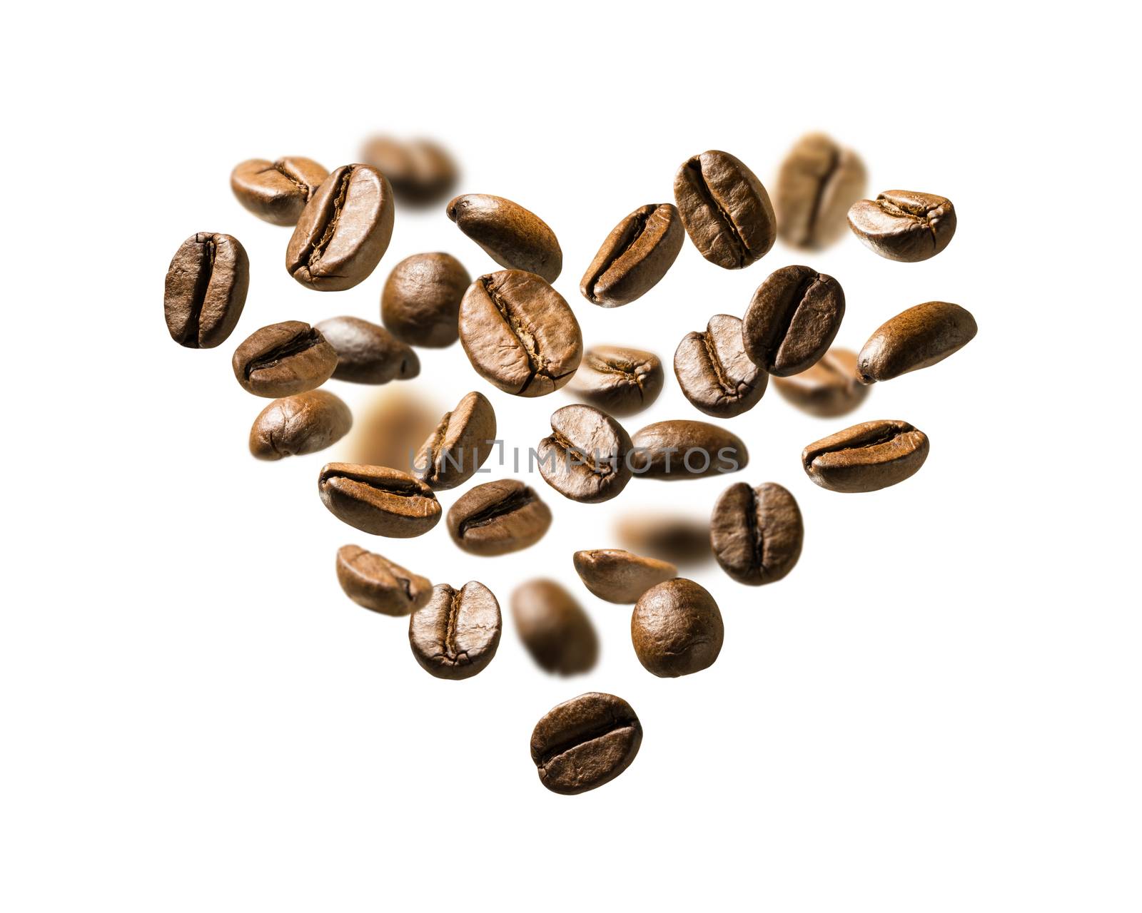 Coffee beans in flight in the shape of a heart by butenkow