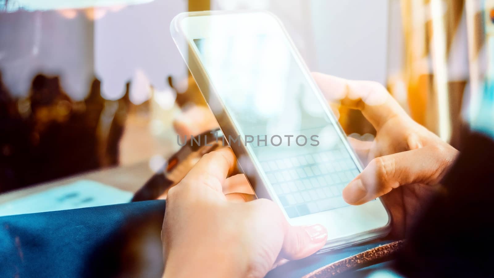 Hands with mobile, double exposure