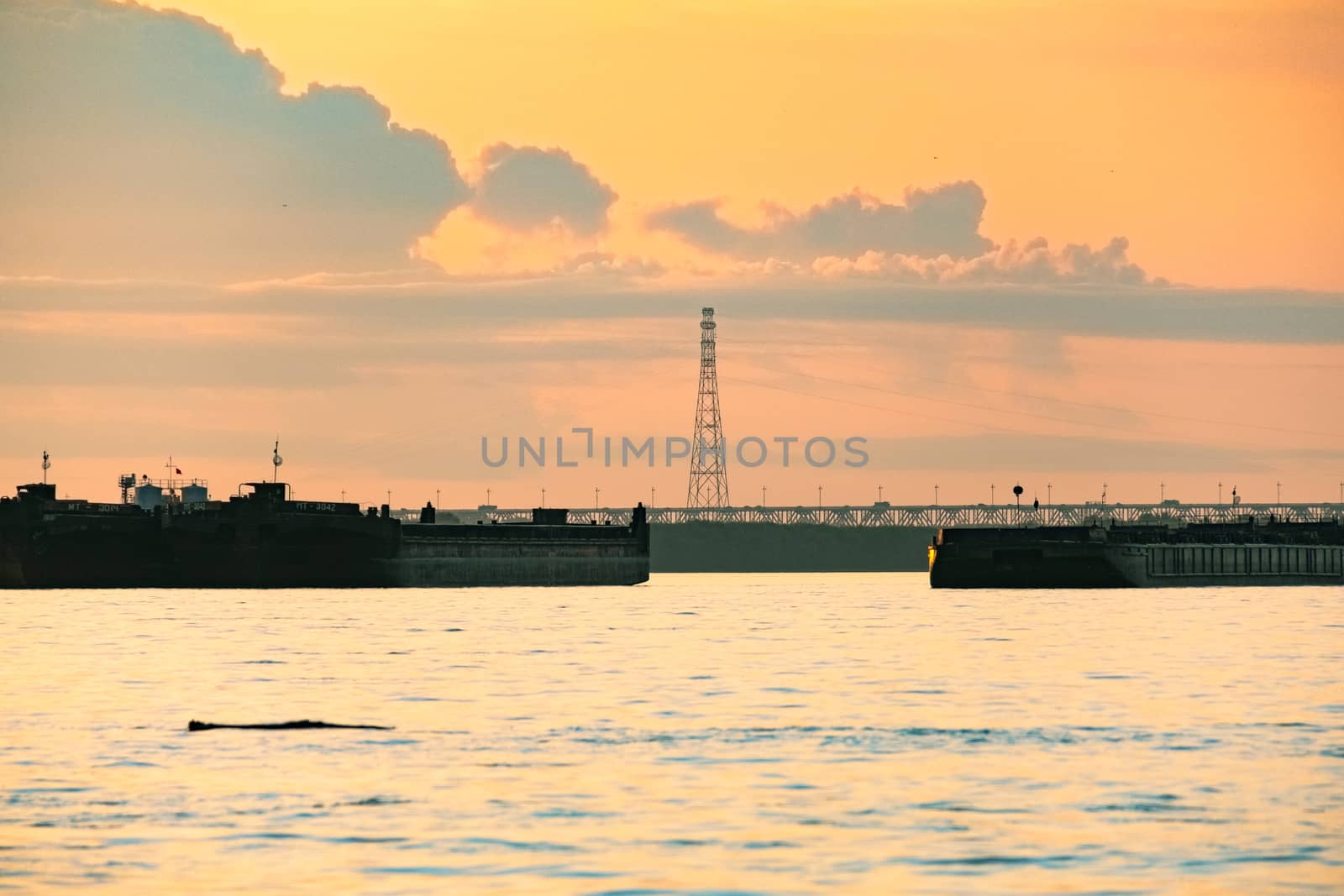 View of the city of Khabarovsk from the Amur river. Urban landscape in the evening at sunset. by rdv27