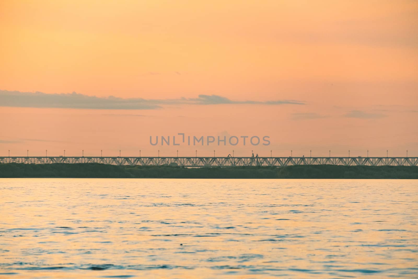 View of the city of Khabarovsk from the Amur river. Urban landscape in the evening at sunset