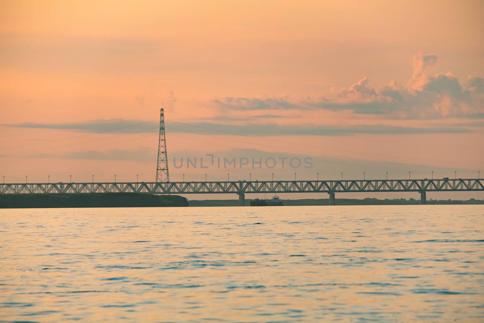 View of the city of Khabarovsk from the Amur river. Urban landscape in the evening at sunset