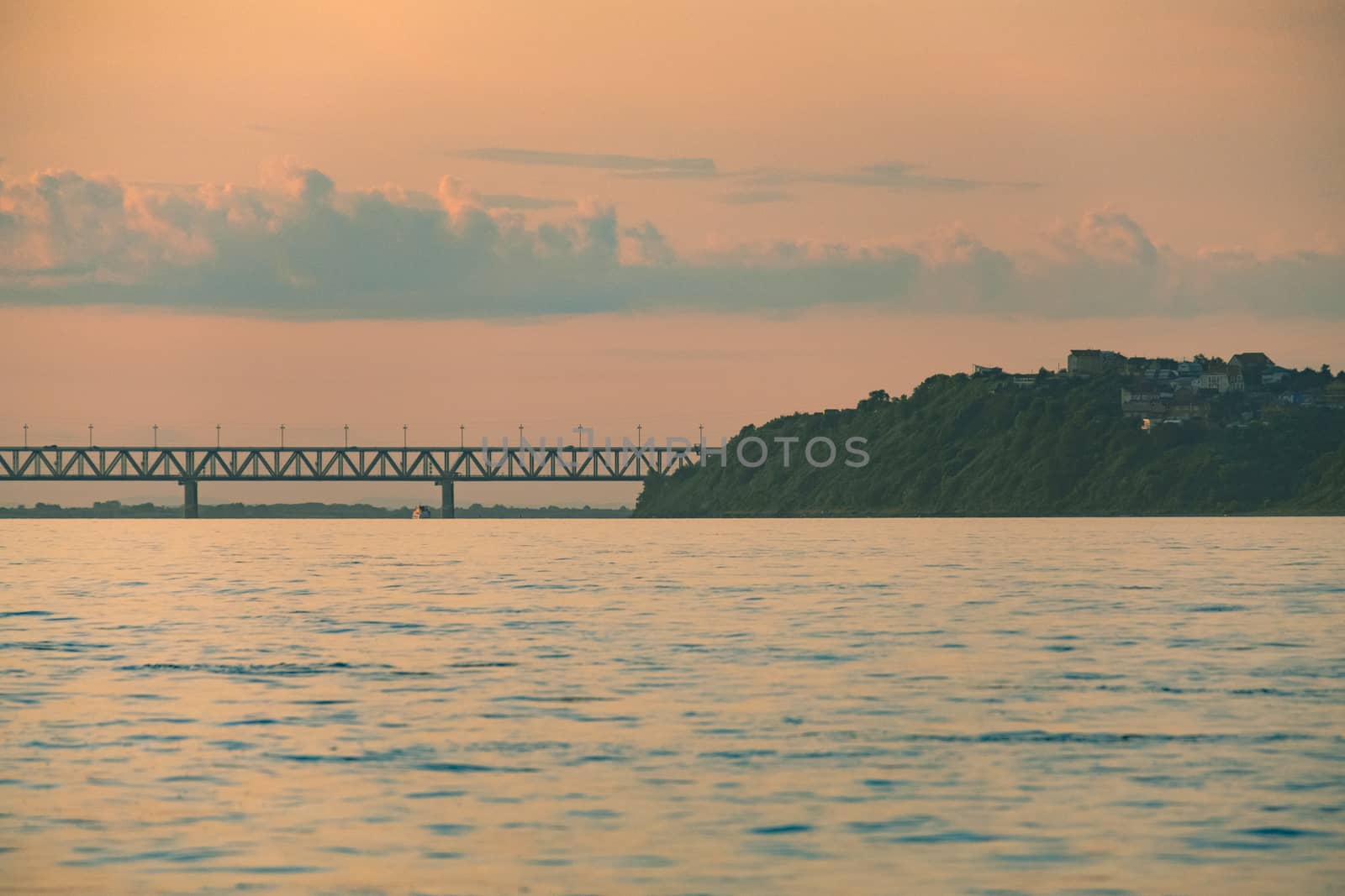 View of the city of Khabarovsk from the Amur river. Urban landscape in the evening at sunset