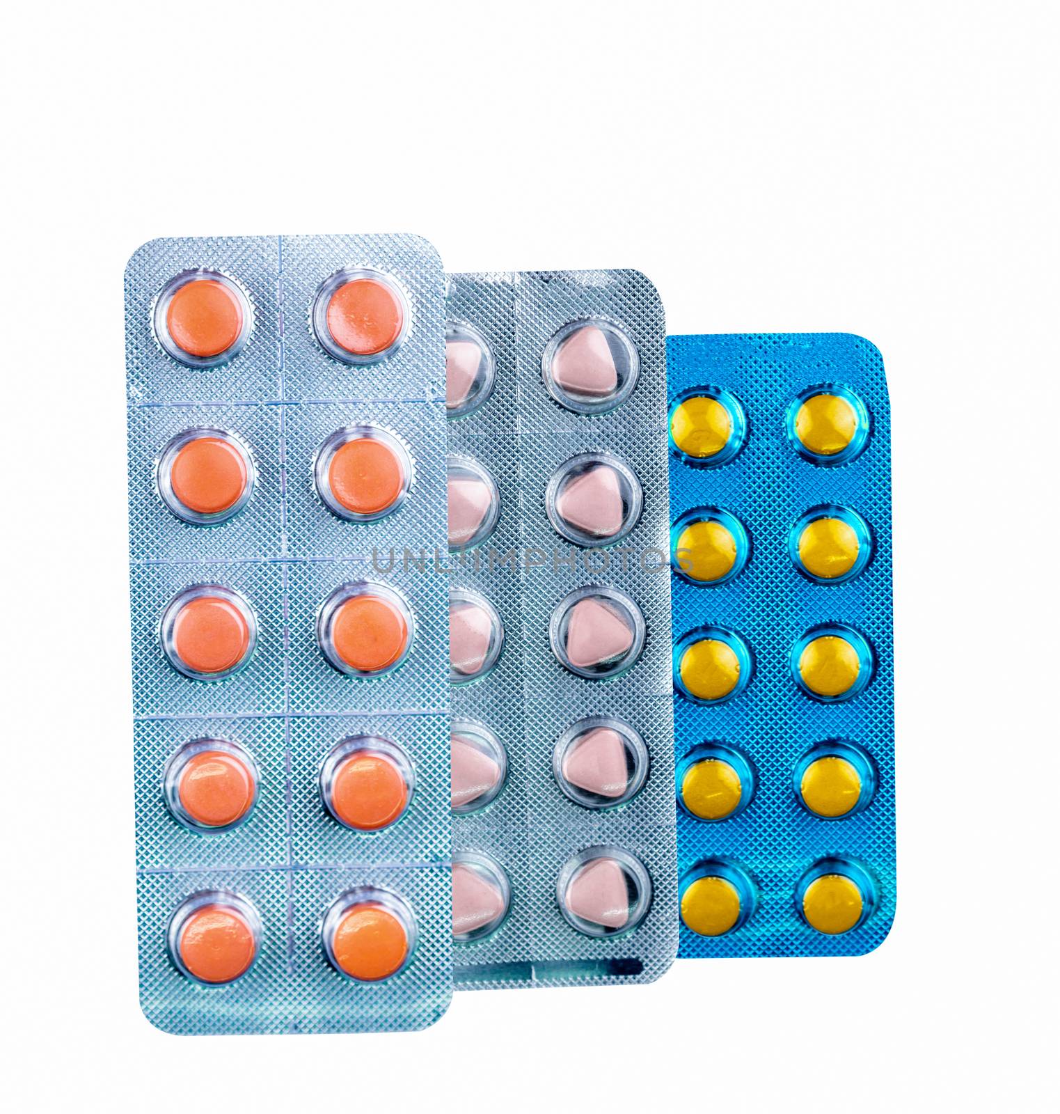 Diclofenac in blister pack isolated on white background. Drug with round and triangle shaped in pack. Film coated tablets. Orange, yellow, and pale pink tablets pills. Painkiller medicine. Pharmacy.