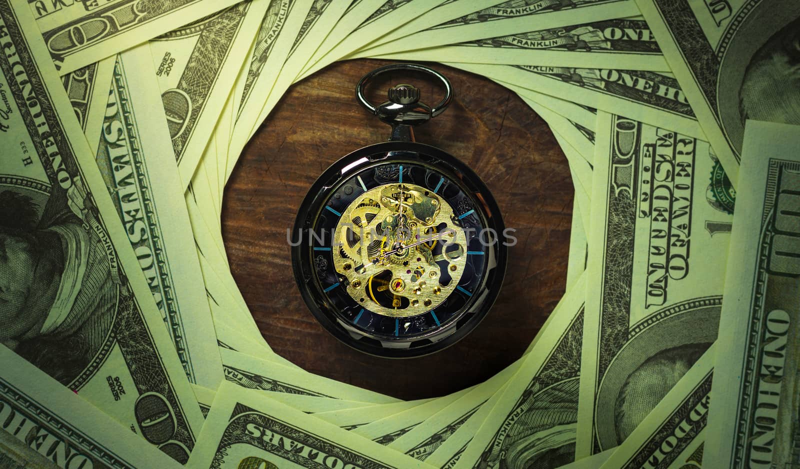 Pocket watch and dollar banknote stacking in darkness background. Concept of Time is money or Business.