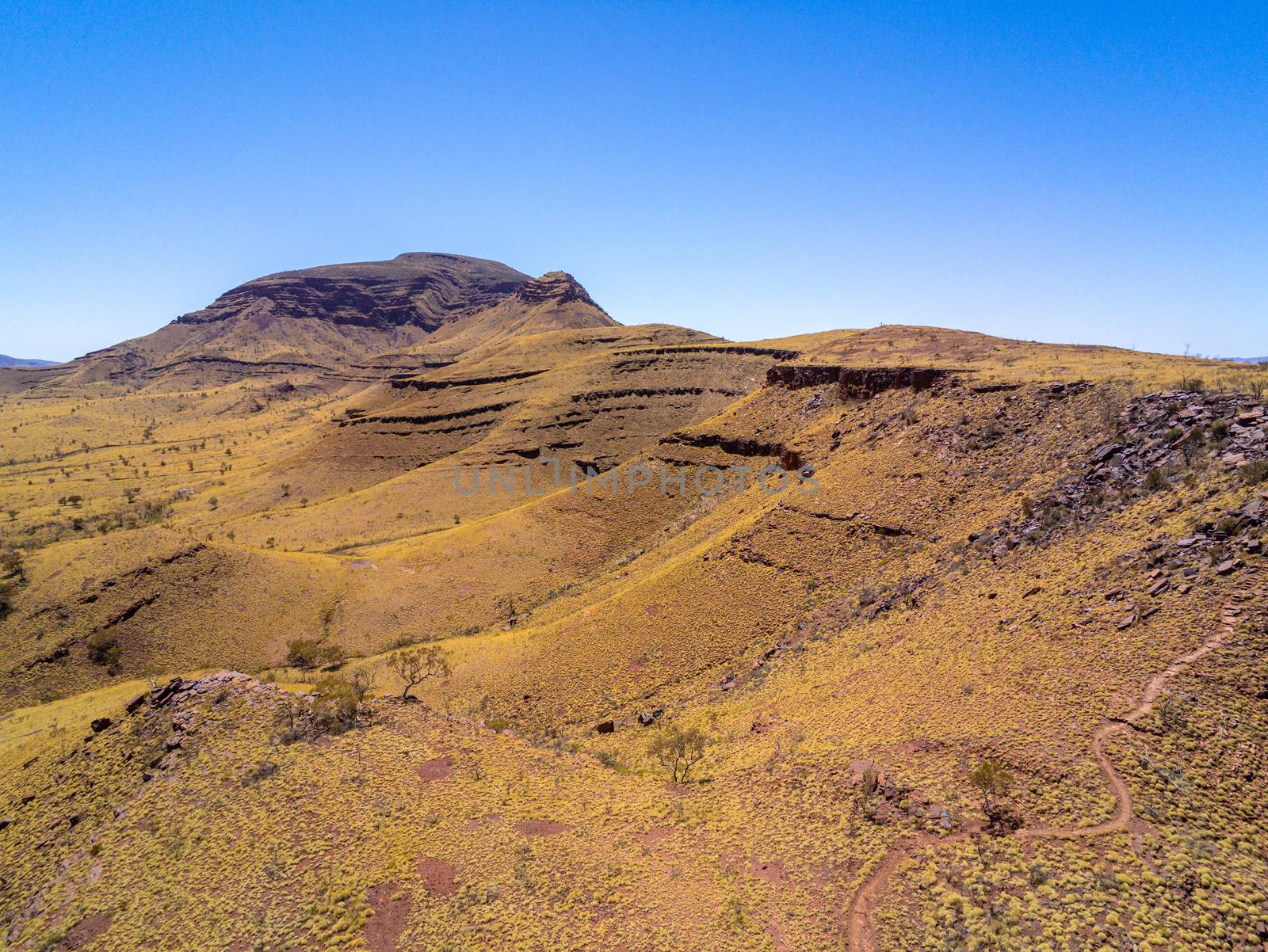 Aerial view of hiking path leading towards top of Mount Bruce at Karijini National Park Australia