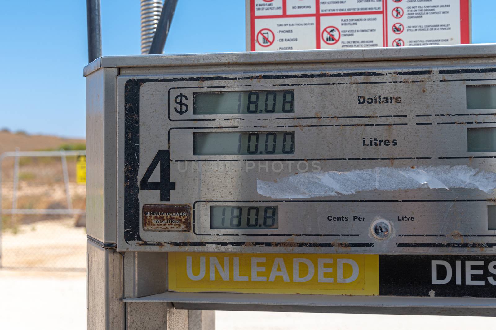 Expensive unleaded petrol and diesel prices at self service gas station in Coral Bay by MXW_Stock