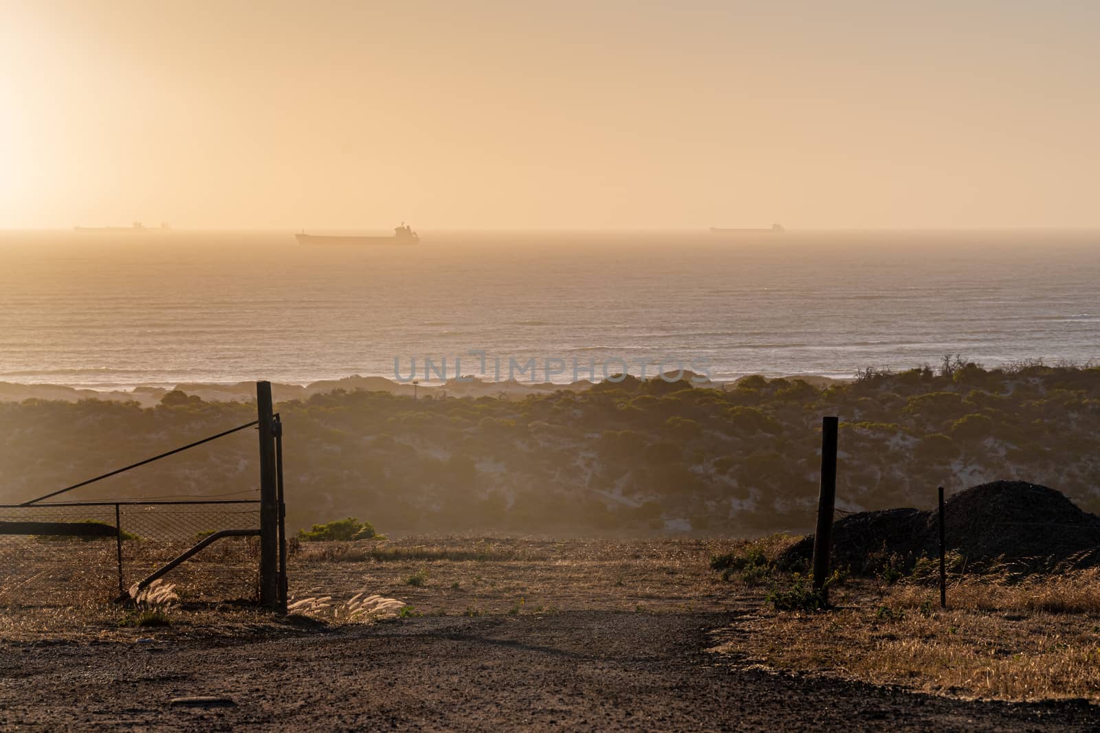 Fence in front of Indian Ocean in Geraldton Western Australia during the sunset
