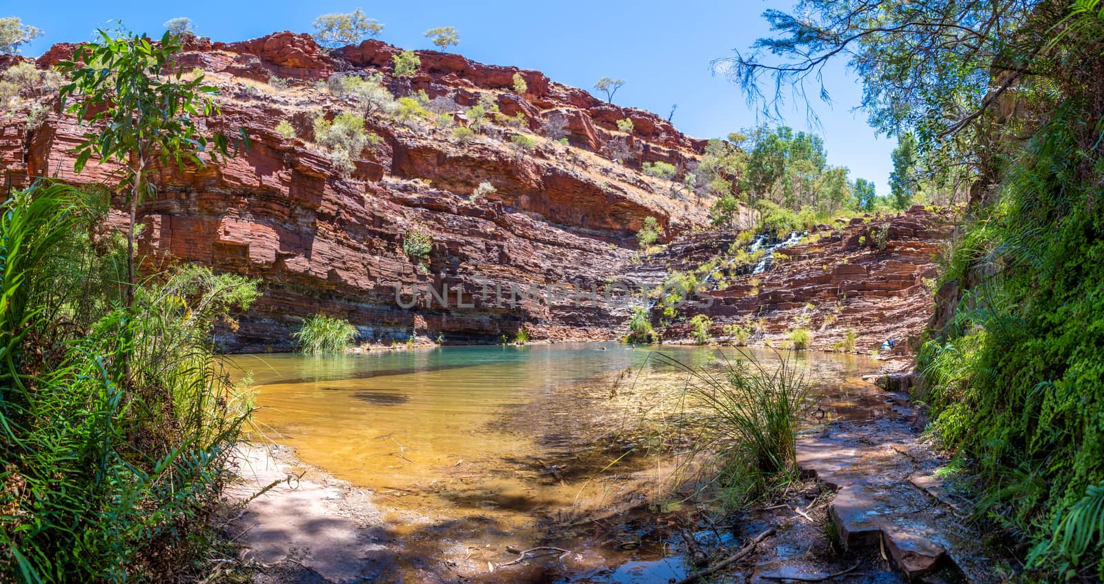 Panorama of Fortescue Falls and pool at the bottom of Dales Gorge at Karijini National Park Australia