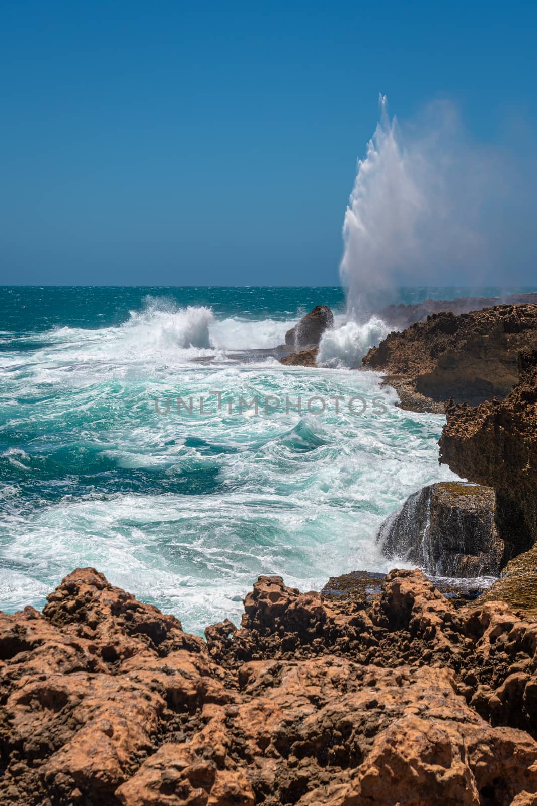 Quobba Blow Holes during windy weather in Western Australia by MXW_Stock