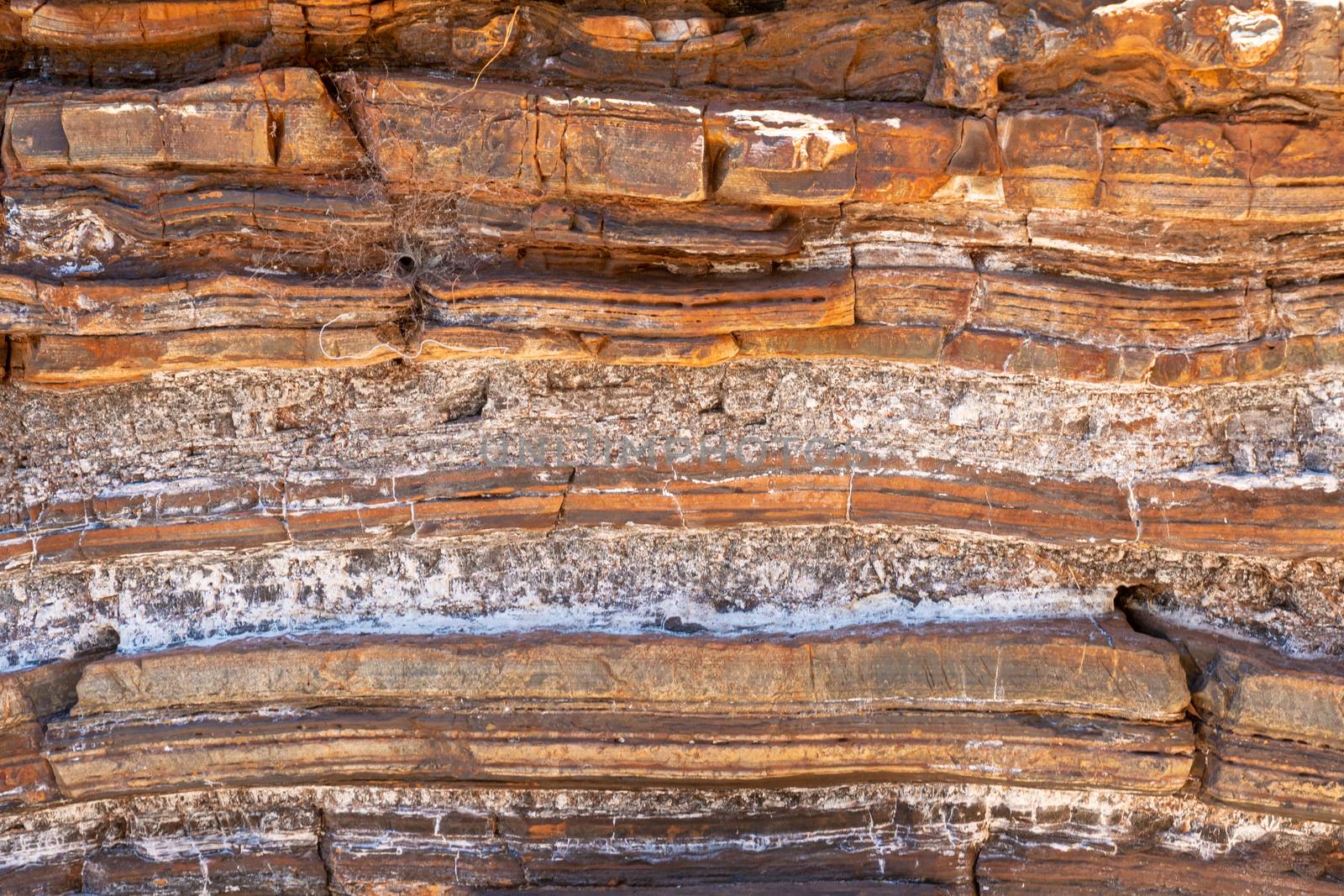 Sediment and rock layers at Karijini National Park in Dales Gorge including natural asbestos by MXW_Stock
