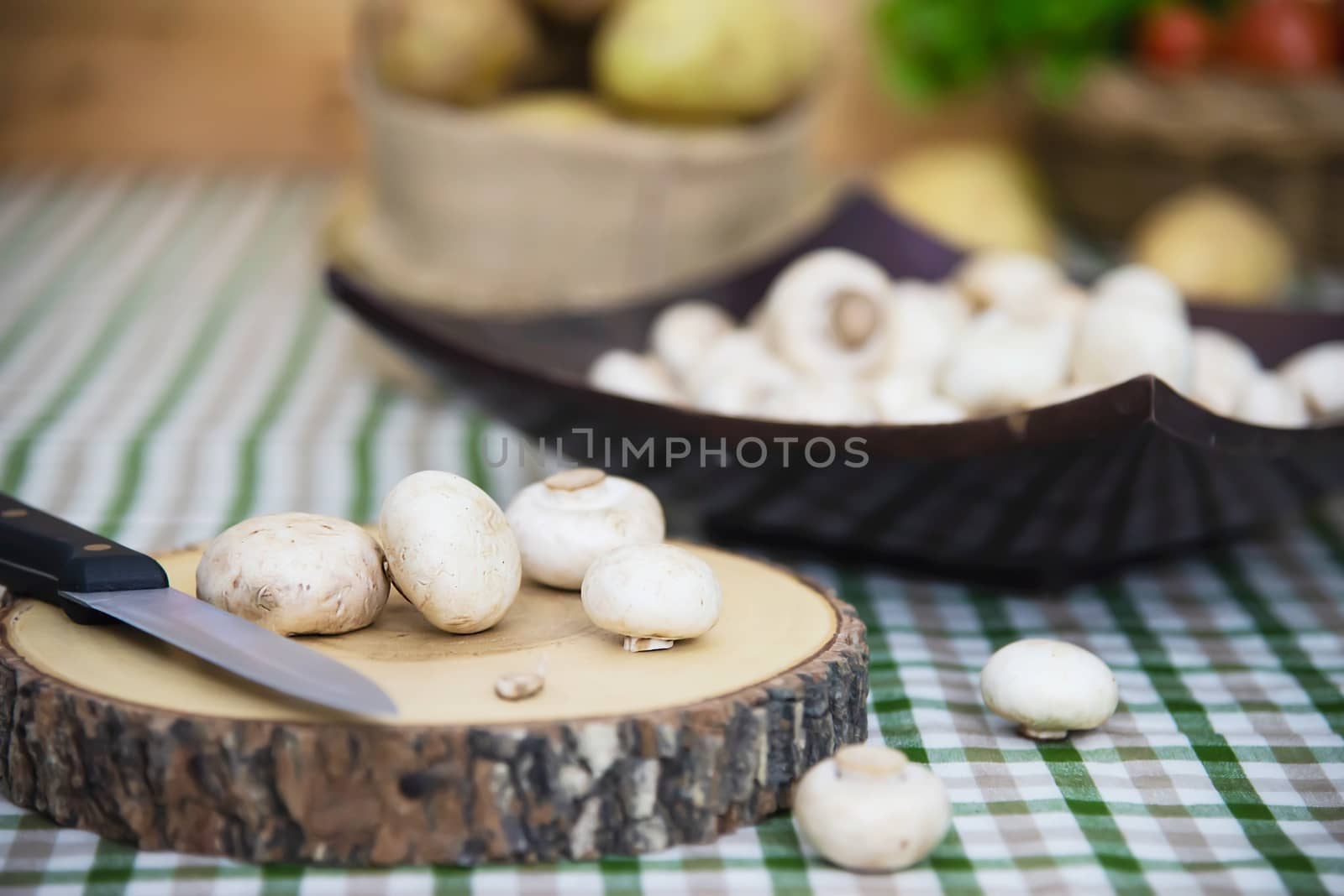 Fresh champignon mushroom vegetable in the kitchen by pairhandmade