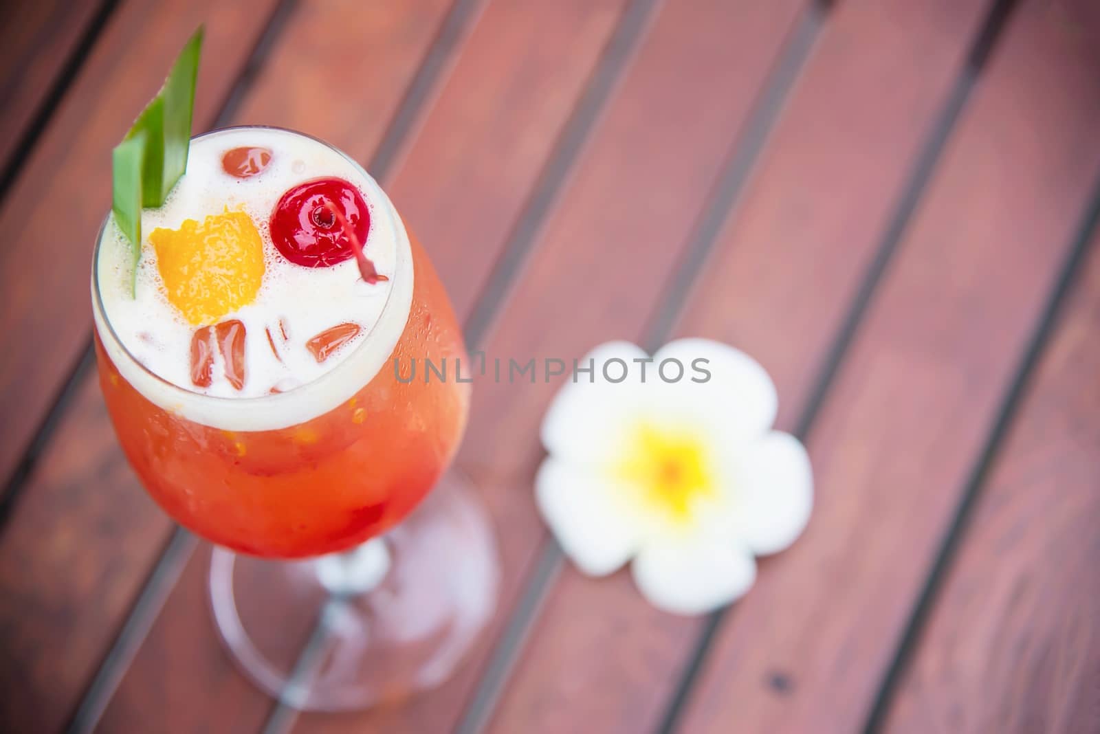 Cocktail recipe name mai tai or mai thai worldwide favour cocktail include rum lime juice orgeat syrup and orange liqueur - sweet alcohol drink with flower in garden relax vacation concept