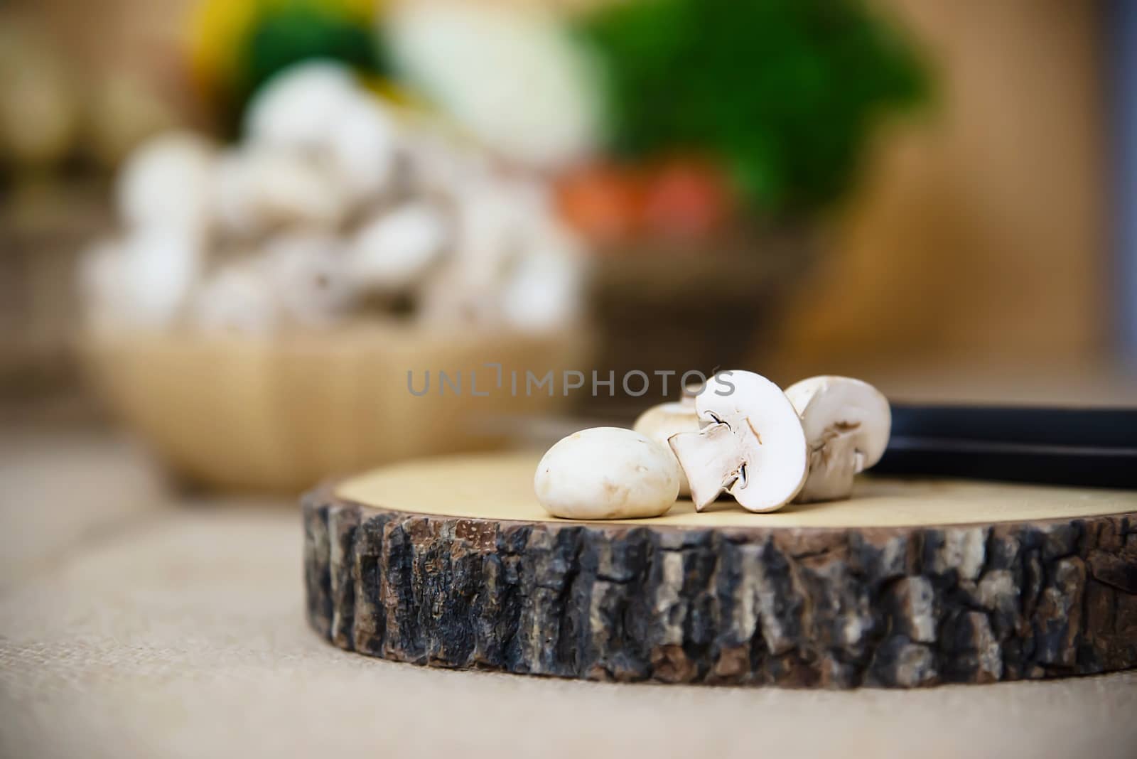 Fresh champignon mushroom vegetable in the kitchen by pairhandmade