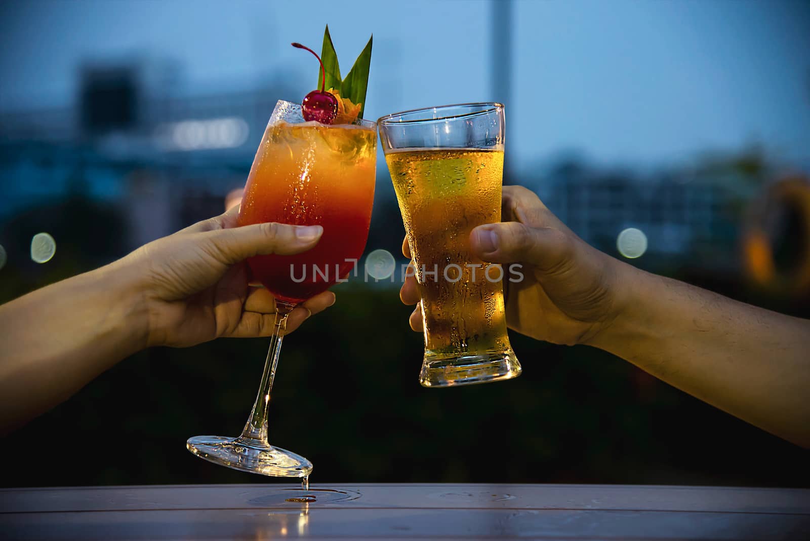 Couple celebration in restaurant with soft drink beer and mai tai or mai thai by pairhandmade